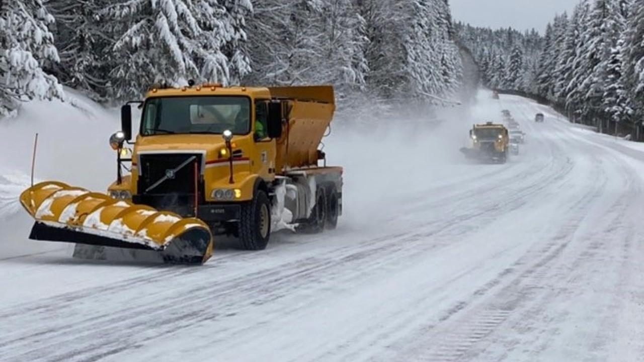 Snowplows clearing Interstate 84 through a snow-covered Columbia River Gorge